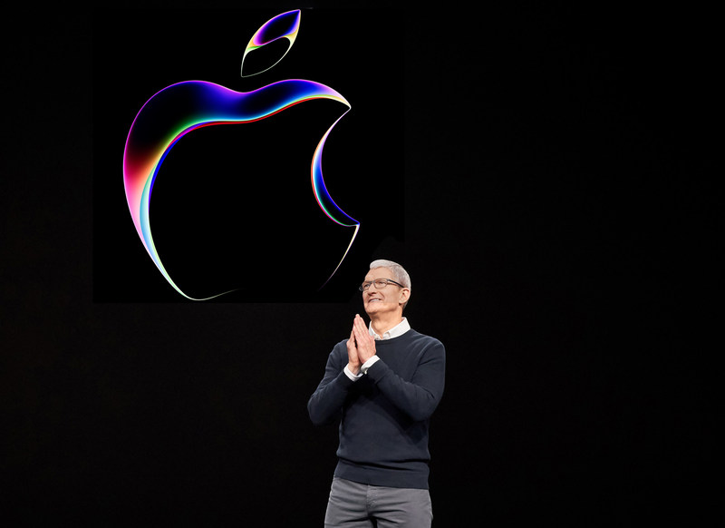 Tim Cook with WWDC 2023 logo